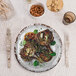 A French Mill melamine plate with food on it on a table.