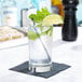 A Libbey Collins glass of water with lime and mint leaves.