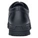 The back of a black leather Shoes For Crews Cade work boot with white stitching.