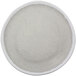 A white plate with black speckled spots.