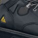 A close up of a black ACE Providence work boot.