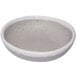 A white ramekin with grey speckles.