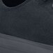 A black Shoes For Crews Delray non-slip shoe on a table.