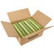 A white cardboard box filled with green Crayola crayons.