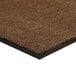 A light brown Lavex Olefin entrance mat with black rubber edges.