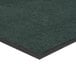 A green Lavex Olefin entrance mat with black trim.
