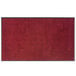 A red Lavex rubber-backed entrance mat with black specks.