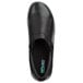 A close-up of a black SR Max slip-on shoe with a green logo.