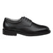 A black women's oxford dress shoe with a soft toe and non-slip sole.