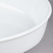 A close up of a white CAC porcelain oval deep dish serving platter.