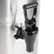 A Bunn stainless steel 3 gallon iced tea dispenser with a black handle and faucet.