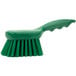 A green Carlisle Sparta pot scrub brush with a handle.