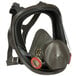 A 3M full face respirator with a clear valve.