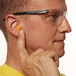 a man wearing safety glasses and a earplug