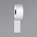 A white rectangular roll of Iconex full tack sticky media linerless receipt paper.