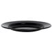 A Crow Canyon Home black speckle enamelware plate with a wide rim.