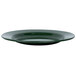 A close up of a Crow Canyon Home Stinson forest green enamelware plate with a wide rim.