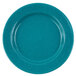 A turquoise Crow Canyon Home enamelware plate with a speckled surface and blue rim.