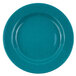 A turquoise plate with white specks and a speckled surface.