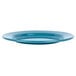 A close up of a Crow Canyon Home turquoise speckle enamelware salad plate with a wide rim.