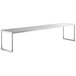 A long rectangular stainless steel shelf above a table.