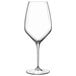 A close-up of a Luigi Bormioli Atelier Sauvignon wine glass with a long stem.