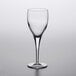 A clear Luigi Bormioli Michelangelo red wine glass on a white surface.