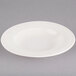 An ivory china soup bowl with an embossed rim.