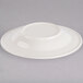 An ivory china soup dish with an embossed rim.