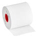 A roll of white Iconex MAXStick Diamond adhesive paper with red circles on it.