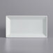 a white rectangular plate on a gray surface