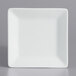 A white square International Tableware porcelain plate with a white rim.