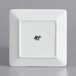 A white square International Tableware porcelain plate with black text.