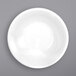 A white round porcelain fruit bowl.
