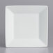 A white square porcelain plate with a white rim.