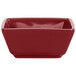 A red square porcelain ramekin with a white background.