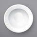 A white International Tableware Bristol porcelain bowl with a rolled edge.