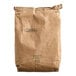 A brown paper bag of Golden Dipt Matzoh Meal with a black label.