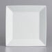 An International Tableware bright white square porcelain plate with a wide rim.