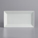 A white rectangular International Tableware porcelain platter on a white surface.