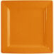 An orange square porcelain plate with a white rim.