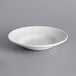 A white International Tableware Bristol porcelain deep pasta bowl with a wide rim.