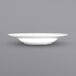 A close up of an International Tableware Bristol white porcelain pasta bowl with a wide rim.