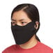 A woman wearing a black Snap Drape Contour face mask.