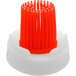 An orange plastic brush cap.