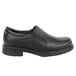 A black Rockport Works men's slip-on dress shoe with a thin rubber sole.