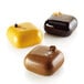 A brown square silicone baking mold with three chocolate squares.