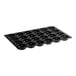 A black Silikomart baking mold with 24 donut cavities.
