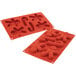 A red Silikomart silicone mold for gingerbread men with 6 cavities.