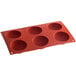 a red silicone baking tray with holes